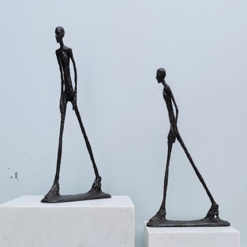 walking man bronze statue